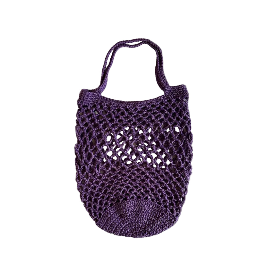 A purple crocheted tote bag with a net design, displayed against a white background.