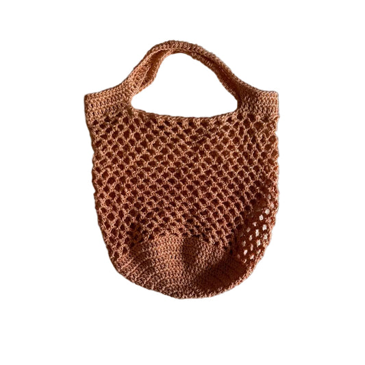 A peach crocheted tote bag with a net design, displayed against a white background.