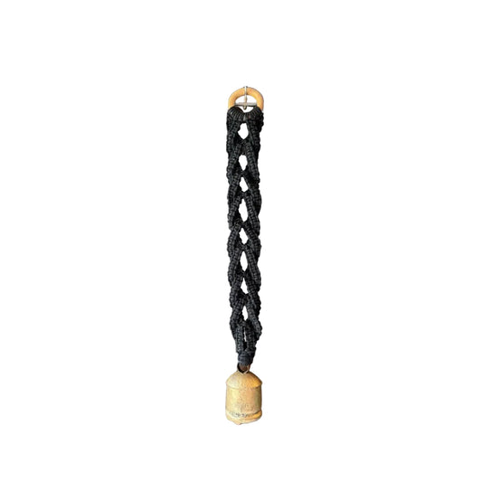 Grey macrame wall hanging with a swiss bell