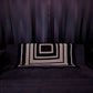 granny square black and grey granny patterned sofa throw on a black sofa with black curtains in the background 
