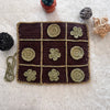 Crocheted tic-tac-toe board with flower patterns on a textured surface.