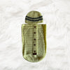Yellow button down Crochet baby cocoon with a baby beanie placed on a white fur fabric